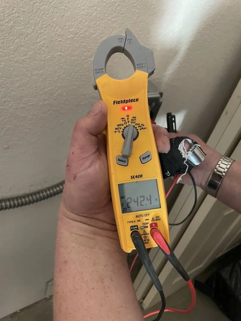 Voltage testing with clamp meter during Electrical Installation Services in Imlay